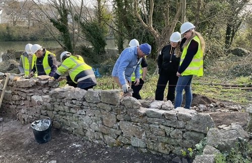 The learners working on the burgage wall in Pembroke